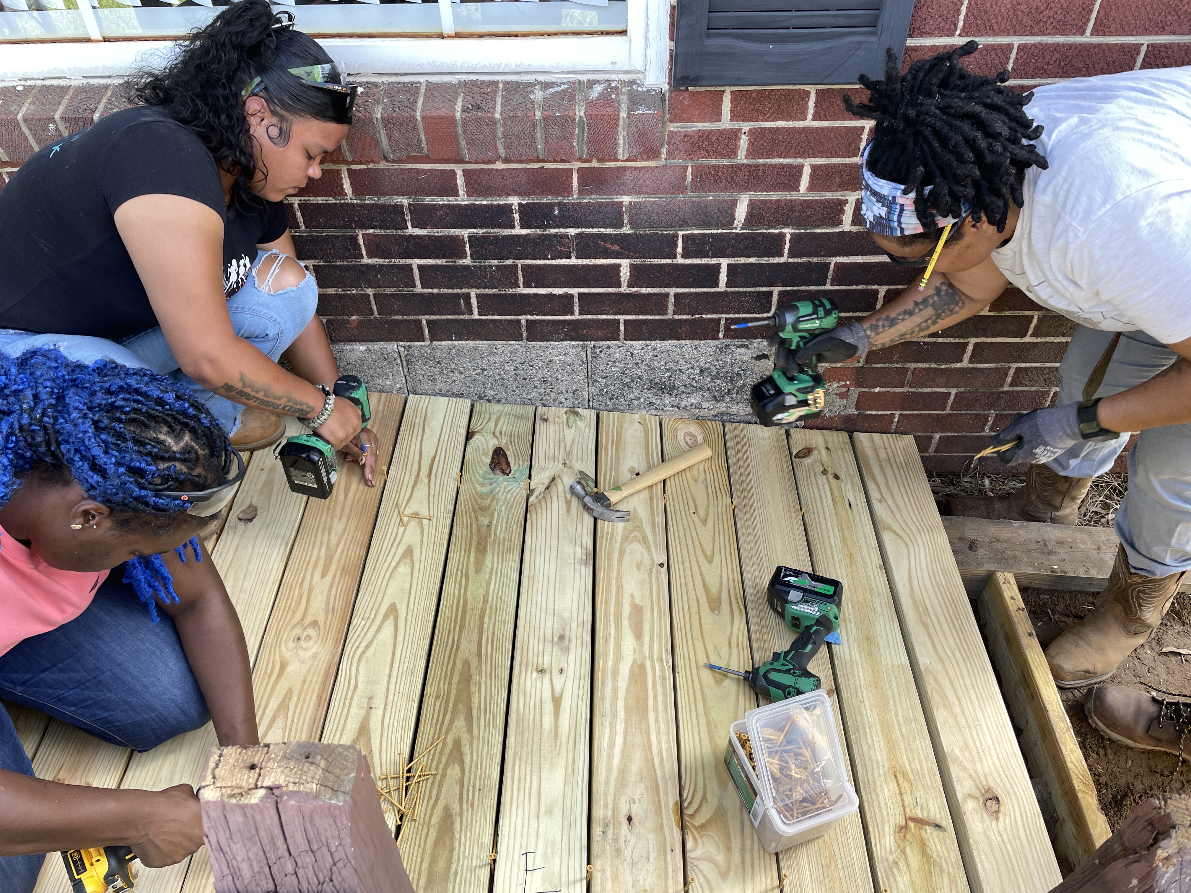 Participants in She Built This City's pre-apprenticeship program constructing a platform